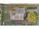 Aerial shot showing the roof of the home, driveway, and surrounding greenery in a residential area at 226 Noxon St, Auburndale, FL 33823