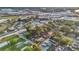 Wide aerial view of residential area near industrial complex, showcasing community and proximity to amenities at 226 Noxon St, Auburndale, FL 33823