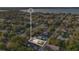 Scenic aerial view of property nestled among lush greenery, highlighting neighborhood and surrounding landscape at 226 Noxon St, Auburndale, FL 33823
