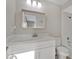 Updated bathroom featuring a new vanity, modern lighting, and a shower-tub combination at 226 Noxon St, Auburndale, FL 33823