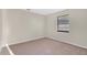Comfortable bedroom with neutral carpet, a window with blinds, and ample space at 226 Noxon St, Auburndale, FL 33823