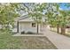 Charming single-story home with a freshly painted white brick exterior and a welcoming carport at 226 Noxon St, Auburndale, FL 33823