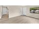 Inviting living room area featuring new floors, neutral walls, and modern fixtures at 226 Noxon St, Auburndale, FL 33823