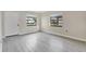 Bright living room showcasing new floors, fresh paint, and an abundance of natural light at 226 Noxon St, Auburndale, FL 33823