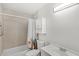 Bathroom featuring tiled shower, white vanity, and medicine cabinet at 2361 Carriage Run Rd, Kissimmee, FL 34741