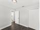 Bedroom featuring dark wood floors, neutral walls and an ensuite bathroom at 2361 Carriage Run Rd, Kissimmee, FL 34741