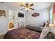 Nicely decorated bedroom featuring two beds, themed wall art, and an ensuite bathroom at 2631 Archfeld Blvd, Kissimmee, FL 34747