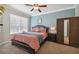 Charming bedroom with a queen bed, side table, and modern wardrobe at 2631 Archfeld Blvd, Kissimmee, FL 34747