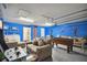 Basement game room features include a foosball table, sofas, and Marvel-themed artwork at 2631 Archfeld Blvd, Kissimmee, FL 34747
