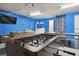 Spacious game room featuring a foosball table, ping pong table, and comfortable seating area at 2631 Archfeld Blvd, Kissimmee, FL 34747