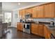 Well-equipped kitchen featuring stainless steel appliances, granite countertops, and ample cabinet space for storage at 2631 Archfeld Blvd, Kissimmee, FL 34747