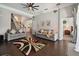 Comfortable living room with hardwood floors, neutral colors, and stairway access at 2631 Archfeld Blvd, Kissimmee, FL 34747