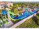 Aerial view of a water park with colorful slides and splash pad, perfect for Gathering fun at 2631 Archfeld Blvd, Kissimmee, FL 34747