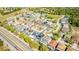 Wide aerial shot of a residential community with a mix of homes, pools, landscaping and roads at 277 Sand Ridge Dr, Davenport, FL 33896