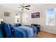 Bright bedroom with twin beds, wood floors, a ceiling fan, and plenty of natural light at 277 Sand Ridge Dr, Davenport, FL 33896
