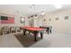 Spacious game room featuring a foosball table and pool table at 277 Sand Ridge Dr, Davenport, FL 33896