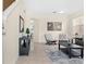Bright living room featuring tile floors, modern decor, and a stylish seating area with lots of sunlight at 277 Sand Ridge Dr, Davenport, FL 33896