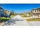 Charming street view showcases various home styles and manicured lawns, creating a welcoming neighborhood atmosphere at 277 Sand Ridge Dr, Davenport, FL 33896