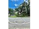 Outdoor basketball court surrounded by trees, offering a place for recreation and exercise at 2956 Lucayan Harbour Cir # 108, Kissimmee, FL 34746