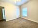 Bedroom features carpeted floors, a closet, and a window that lets in plenty of natural light at 2956 Lucayan Harbour Cir # 108, Kissimmee, FL 34746