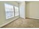 Bedroom features carpeted floors, a closet, and a window that lets in plenty of natural light at 2956 Lucayan Harbour Cir # 108, Kissimmee, FL 34746