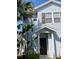 Charming townhome exterior with a brown front door and well-maintained landscaping at 2956 Lucayan Harbour Cir # 108, Kissimmee, FL 34746