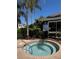 Community hot tub with palm trees and landscaping at 2956 Lucayan Harbour Cir # 108, Kissimmee, FL 34746