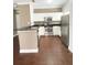 Modern kitchen with stainless steel appliances, white cabinets, and dark countertops at 2956 Lucayan Harbour Cir # 108, Kissimmee, FL 34746