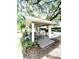 Outdoor kitchen includes a fireplace, grill, countertop and seating area at 2956 Lucayan Harbour Cir # 108, Kissimmee, FL 34746