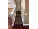 Carpeted staircase with white handrails leading to the upper level of the home at 2956 Lucayan Harbour Cir # 108, Kissimmee, FL 34746