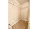 Spacious walk-in closet with tiled flooring and shelving unit for optimal storage at 2956 Lucayan Harbour Cir # 108, Kissimmee, FL 34746