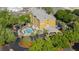 Beautiful aerial view of Galleria Palms Hotel showcasing lush landscaping and sparkling pool at 3000 Maingate Ln # 520, Kissimmee, FL 34747