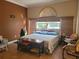 Bedroom featuring a large window and comfortable furnishings at 3150 Appaloosa Ct, Kissimmee, FL 34746