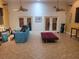 Open room with high ceilings, office area, and tile floors at 3150 Appaloosa Ct, Kissimmee, FL 34746