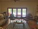 Bright living room with tile floors and doors leading to the pool area at 3150 Appaloosa Ct, Kissimmee, FL 34746