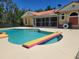 Gorgeous pool surrounded by ample deck space and a screened-in lanai, perfect for outdoor relaxation and entertainment at 3150 Appaloosa Ct, Kissimmee, FL 34746