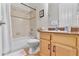 Neutral bathroom features a vanity, toilet and shower/tub combination at 322 N Rhodes St, Mount Dora, FL 32757