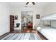 View from bedroom to the living area with hardwood floors and neutral decor at 322 N Rhodes St, Mount Dora, FL 32757