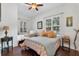 Bright bedroom with wood floors and plenty of natural light at 322 N Rhodes St, Mount Dora, FL 32757