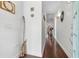 Bright hallway with hardwood floors and elegant decor leading to the home's living spaces at 322 N Rhodes St, Mount Dora, FL 32757