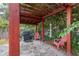 The covered pergola area features a grill and seating creating a perfect spot for outdoor cooking and relaxation at 322 N Rhodes St, Mount Dora, FL 32757