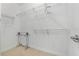 Bright walk-in closet featuring wire shelving and carpeted floor at 322 N Rhodes St, Mount Dora, FL 32757
