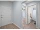 Hallway with view of bedroom, bathroom and front door at 328 Woodland Trl, Lady Lake, FL 32159