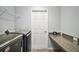 Laundry room with countertop, shelving, washer, and dryer at 328 Woodland Trl, Lady Lake, FL 32159
