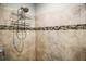 Shower featuring tile surround, with built in caddy at 328 Woodland Trl, Lady Lake, FL 32159