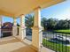 Balcony with elegant columns and views of the neighborhood at 3687 Farm Bell Pl, Lake Mary, FL 32746