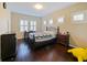 Bedroom with hardwood floors, plantation shutters, and traditional-style furniture at 3687 Farm Bell Pl, Lake Mary, FL 32746