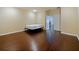 Spacious bedroom with hardwood floors and natural light from an open door at 3687 Farm Bell Pl, Lake Mary, FL 32746