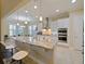 Bright and airy kitchen with a large island, white cabinets, and modern appliances at 3687 Farm Bell Pl, Lake Mary, FL 32746
