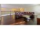 Upstairs living room with hardwood floors and a comfortable leather couch at 3687 Farm Bell Pl, Lake Mary, FL 32746